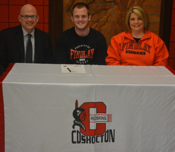 Ben Batchelor, center, signed his letter of intent to play soccer at the University of Findlay on Feb. 8 at Coshocton High School. He is pictured with his father and mother, Bob and Shelley Batchelor. Josie Sellers | Beacon