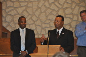 Dr. Ben Carson (left) is being introduced by Shiloh Missionary Baptist Church pastor Cliff Biggers prior to speaking to a full house at the church on Sunday afternoon, Oct. 30. Mark Fortune | Beacon