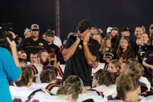 Ridgewood High School Head Football Coach John Slusser is pictured addressing his team after they beat River View 42-0 on Sept. 9. The victory was Slusser’s 100th with Ridgewood. Cortney Ringwalt | Beacon