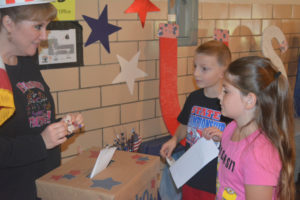 Tiffany Haines (far left) is pictured helping second graders at Keene Elementary School cast their ballot in the school’s mock election that was held Nov. 8. Josie Sellers | Beacon