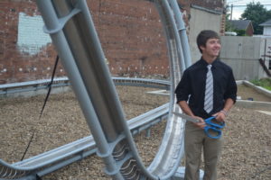 Jayden Kelley, a 2017 River View High School graduate, had the pleasure of cutting the ribbon to officially unveil the roller coaster art piece at the artPARK on Main Street. Josie Sellers | Beacon