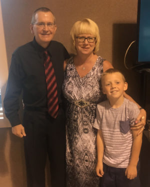 Pastor Chris Cutshall stands with his wife and son after being honored for his 30th year at Fresno Bible Church on Sunday, Aug. 14. Andrew Everhart | Beacon