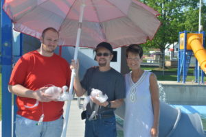 Lake Park Aquatic Center gladly accepted donations from volunteers who help with the kids swimming program. Pictured are volunteers Sher Alloway and Darrell Dunfee with Lake Park Aquatic Center Assistant Manager Rachel Schlarb. Coshocton’s pool also received two lifeguard umbrellas and two Ambu Spur II Bag Resuscitators. Josie Sellers | Beacon