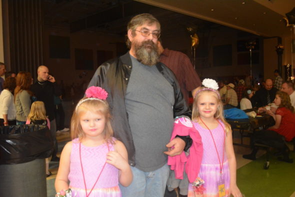 Bayleigh Cunningham and Jayleighn Cunningham attended the father/daughter dance at Coshocton Elementary with their grandfather, Kevin Cunningham.