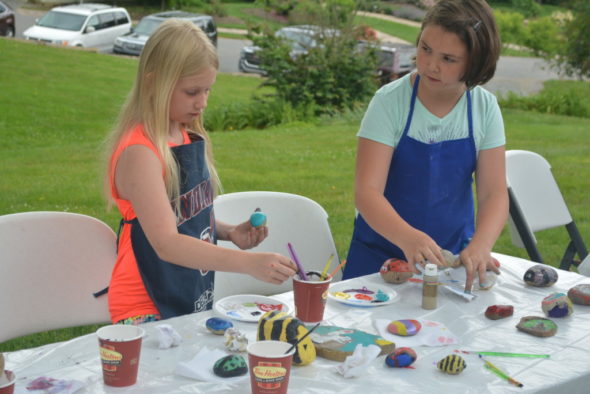 Natalie Strange and Hannah McVay enjoyed painting rocks together on June 6 at Clary Gardens. Josie Sellers | Beacon