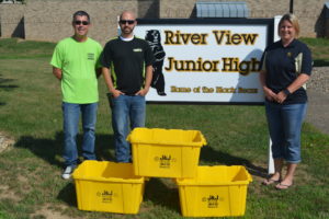 With the help of Jeff Wherley from the Coshocton County Recycling & Litter Prevention Office, Michelle Zimmerman, a teacher at River View Junior High, was able to get 24 new containers for the school’s recycling program that Kimble donated on Aug. 1. Pictured are Wherley, Andrew Kimble, from Kimble and Zimmerman. Josie Sellers | Beacon
