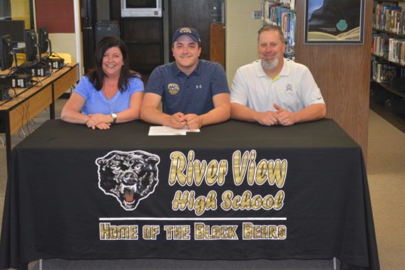 Jake Moore, center, signed his letter of intent to golf at Kent State Tuscarawas on April 26 in the library at River View High School. Pictured with him are his mother Desiree Moore and his father David Moore. Josie Sellers | Beacon